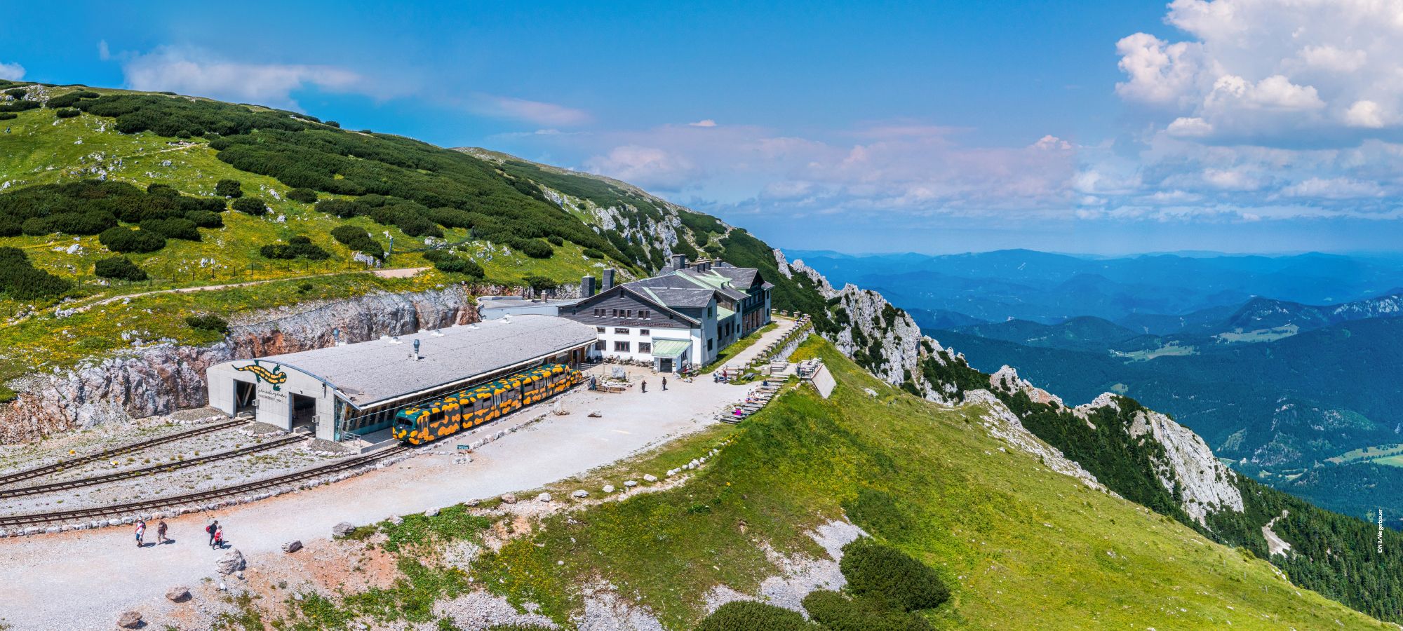 Summit station of the Schneebergbahn with panoramic views of the surrounding mountains.